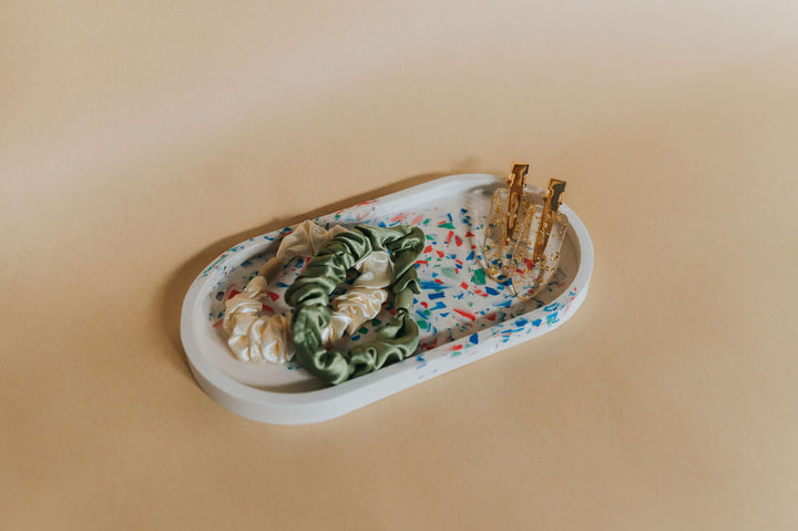 Assorted pasta on a decorative plate with a beige background